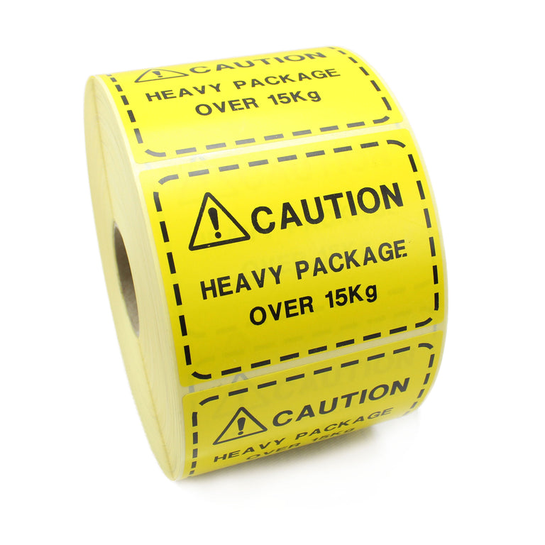 Caution Heavy Package over 15kg. Yellow and Black printed shipping labels. 100mm x 75mm.