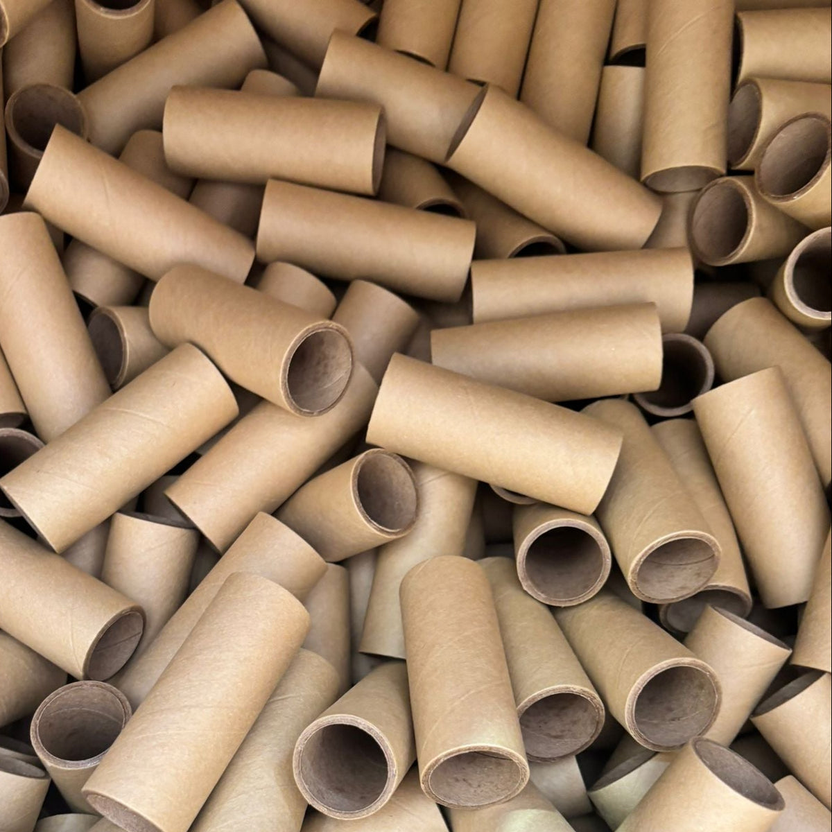 Pile of brown paper towel rolls