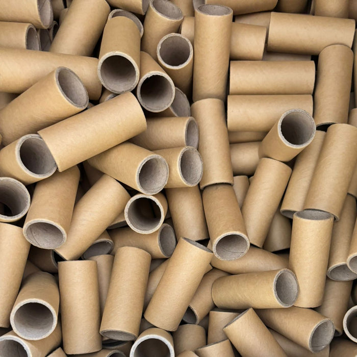 Large pile of cardboard tubes